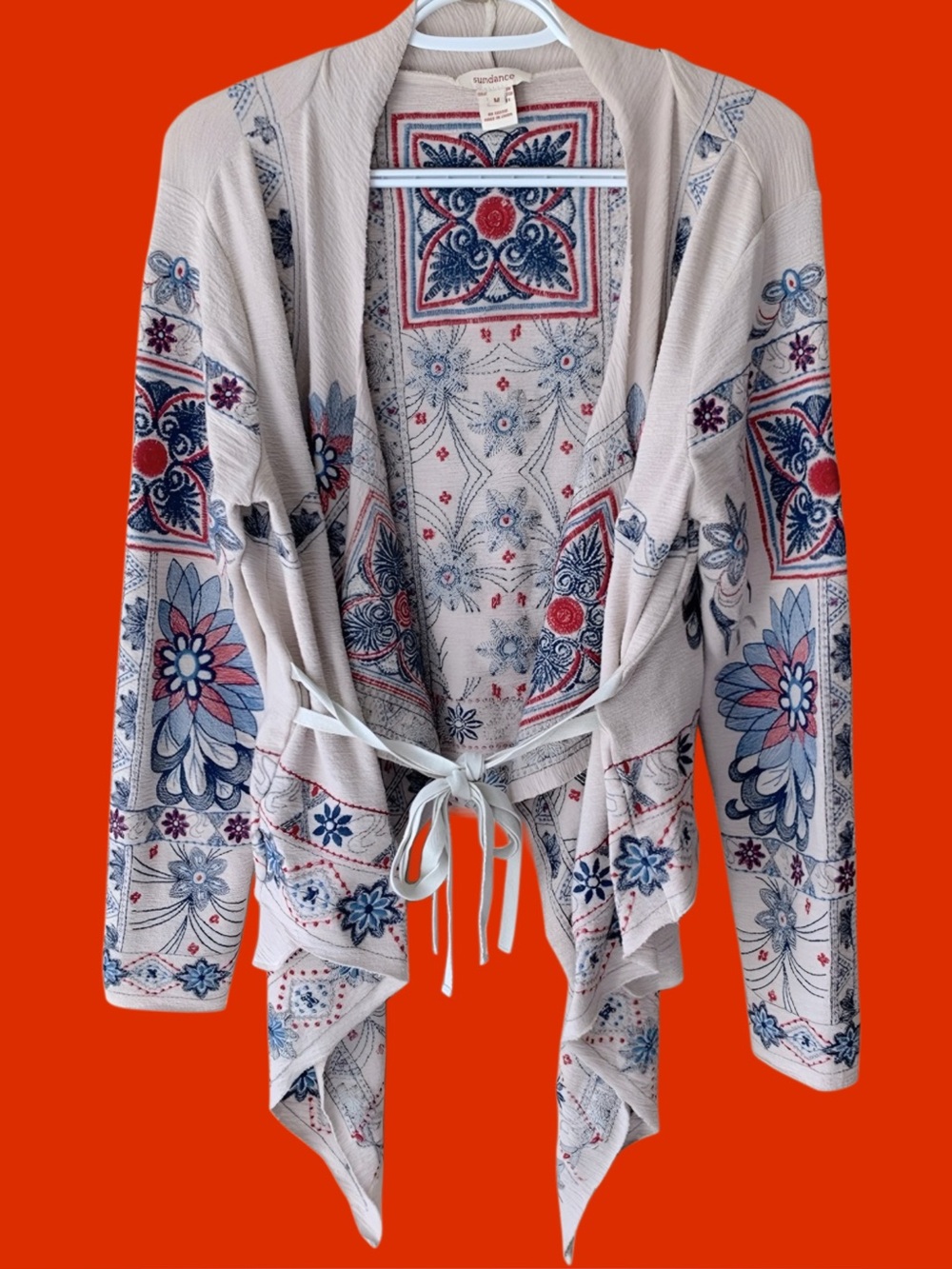 Sundance Cream Open front sweater jacket with Blue and Red Embroidered Accents.